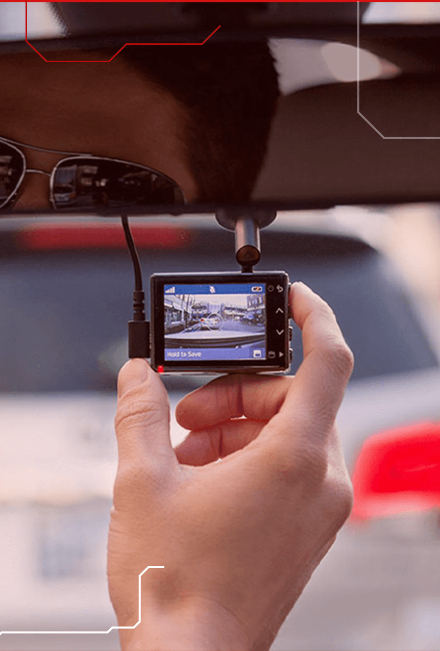 Dashcam mounted behind the windscreen of a car